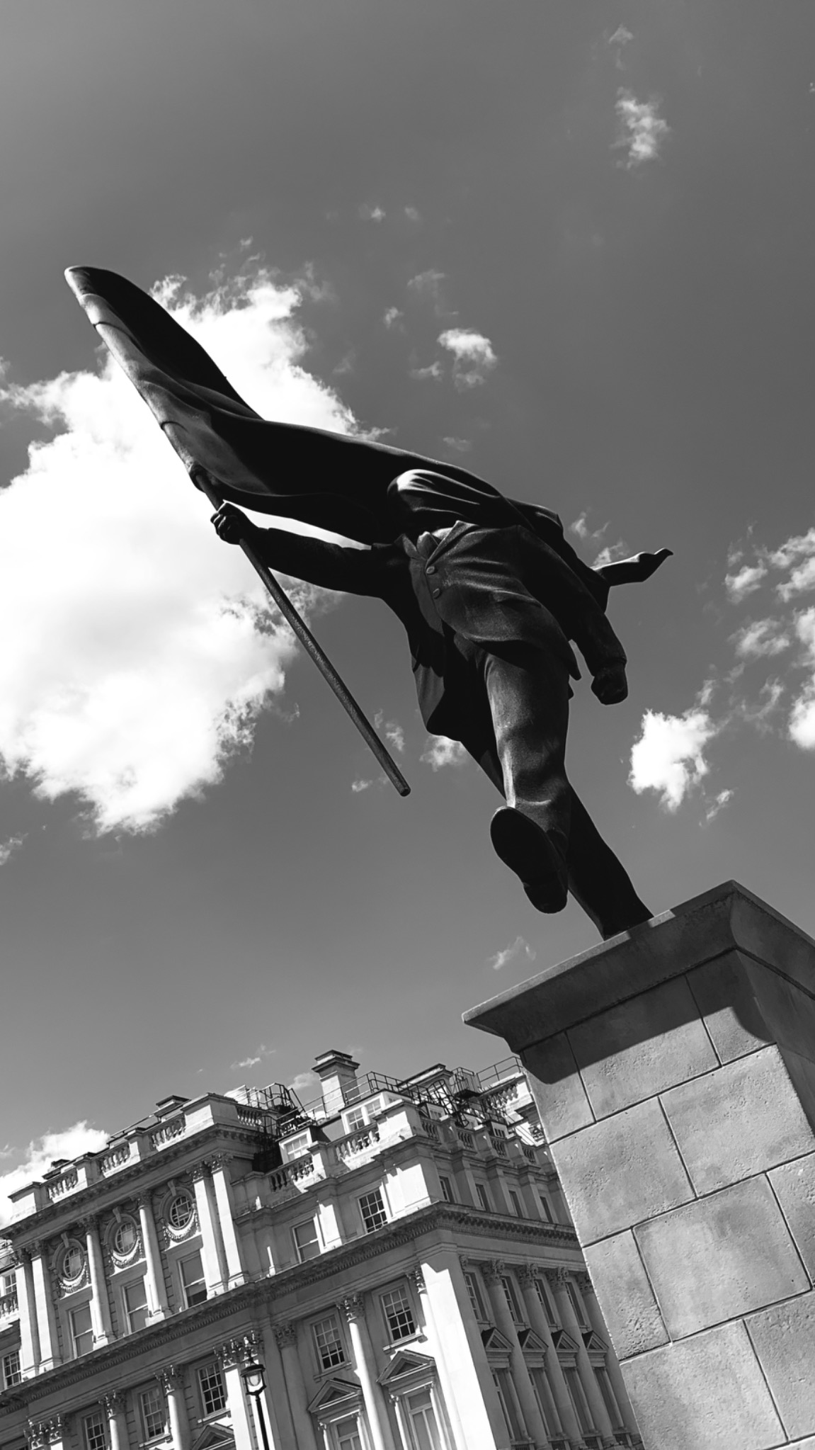 Black and white photograph of a monument against the sky in London